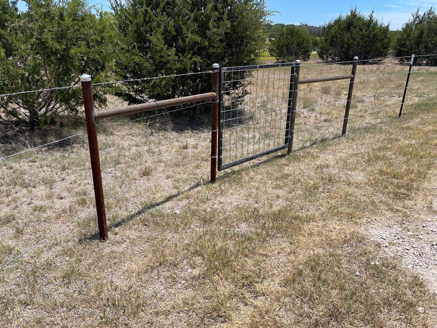 4 wire barb wire fence with t-post and 2 3/8 drill pipe
